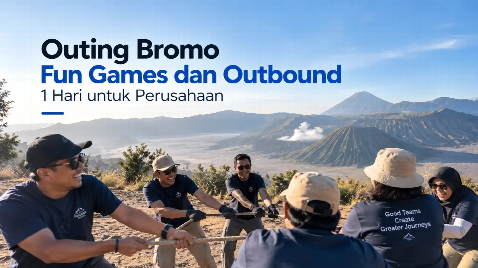 Rombongan karyawan bermain tarik tambang saat outing dengan latar Gunung Bromo